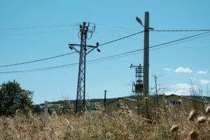 ADSS fiber optic cable aerial route with utility poles and overhead lines