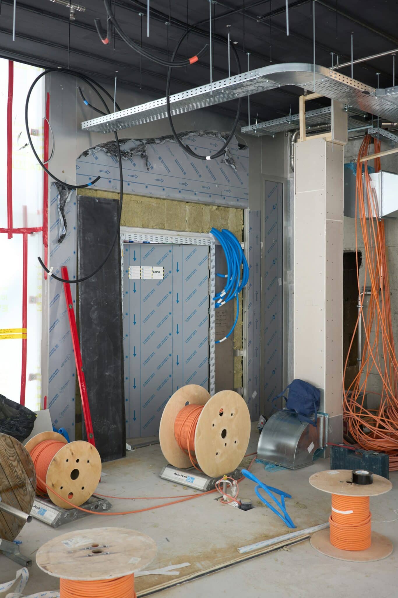 Fiber optic cable drums and wiring at an outdoor construction site